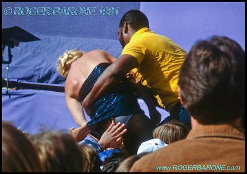 woman receiving medical assistance after passing out at rolling stones concert © roger barone 1981