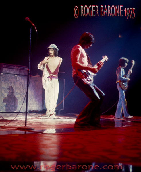 Mick Jagger, Keith Richards & Bill Wyman of the Rolling Stones in concert at the Spectrum in Philadelphia.. © roger barone 1975