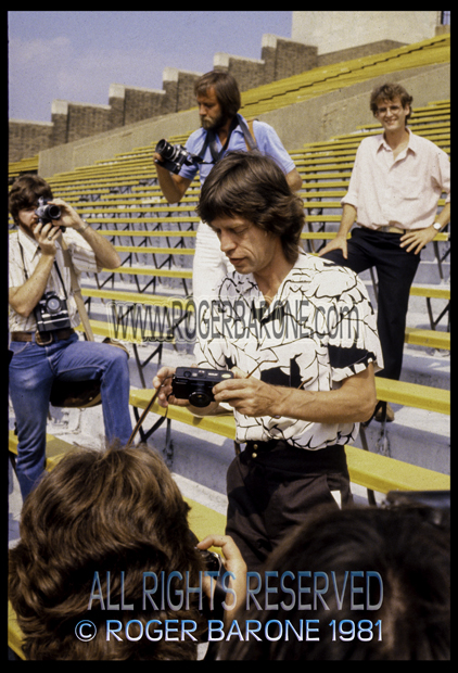 Mick Jagger with camera prepares to take a photo a JFK Stadium (8/26/1981) photo by roger barone