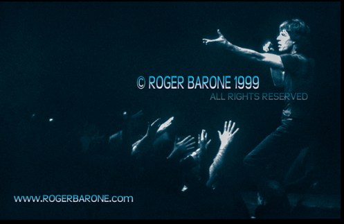 Mick Jagger sings among fans on secondary stage. First Union Center (3/15/12) © roger barone 1999