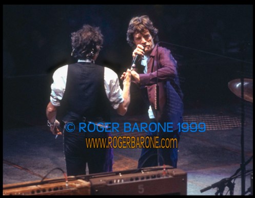 Rolling Stones Mick Jagger and Keith Richards clasp hands at Philly First Union Center concert (3-15-99) © roger barone