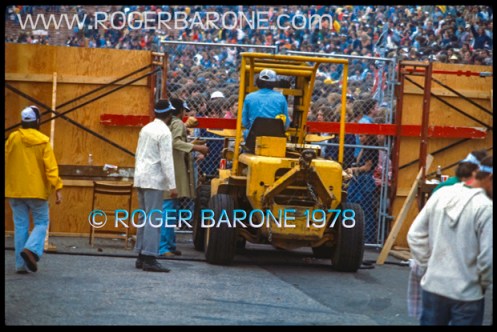 Rolling Stones security and staff bolster fences at JFK Stadium as fans began to riot (7/17/78) photo roger barone