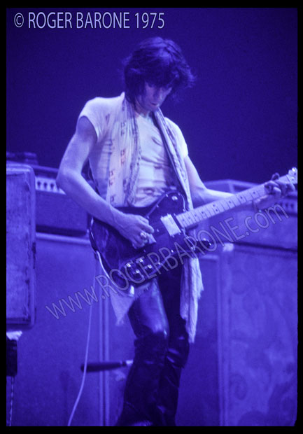 keith_blue_lights_75 Keith Richards in blue lights on Spectrum Stage playing black telecaster guitar (6/29/75) © Roger Barone 1975
