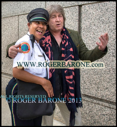 Rolling Stones' guitarist Mick Taylor requests photo with center city district employee. June 23, 2013. © ROGER BARONE