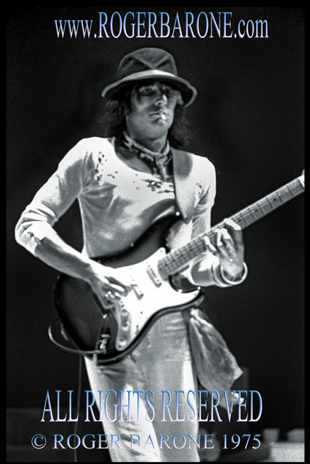 Future Rolling Stones guitarist Ronnie Wood performing with Rod Stewart at Spectrum 1975 © roger barone 