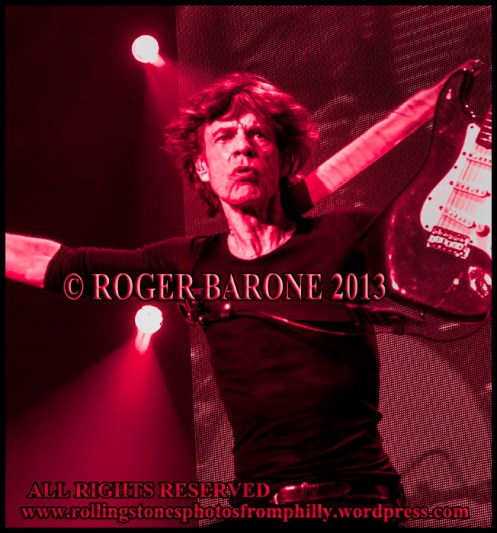 mick jagger with a fender stratacaster accessory around his shoulder, june 21, 2013. Photo roger barone