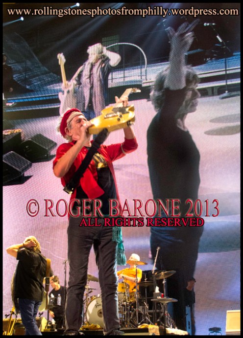 Keith Richards raises  telecaster guitar during encore. June 21, 2013 rolling stones Wells Fargo Center © roger barone