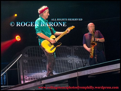Saxophone player gets the spotlight during Rolling Stones "Brown Sugar" photo by roger barone philly june 21, 2013