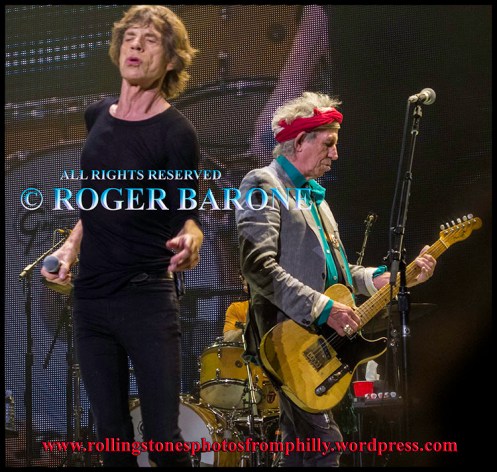 Mick Jagger and Keith Richards singing "One More Shot" at Wells Fargo Center, June 21, 2013, photo by roger barone