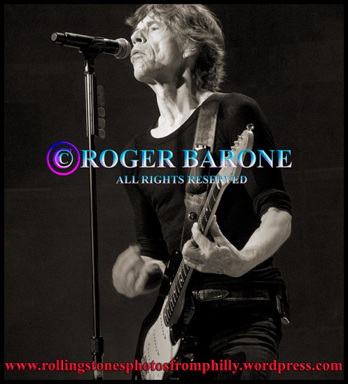 Mick Jagger playing black fender stratocaster guitar Wells Fargo Center June 21, 2013 photo: roger barone