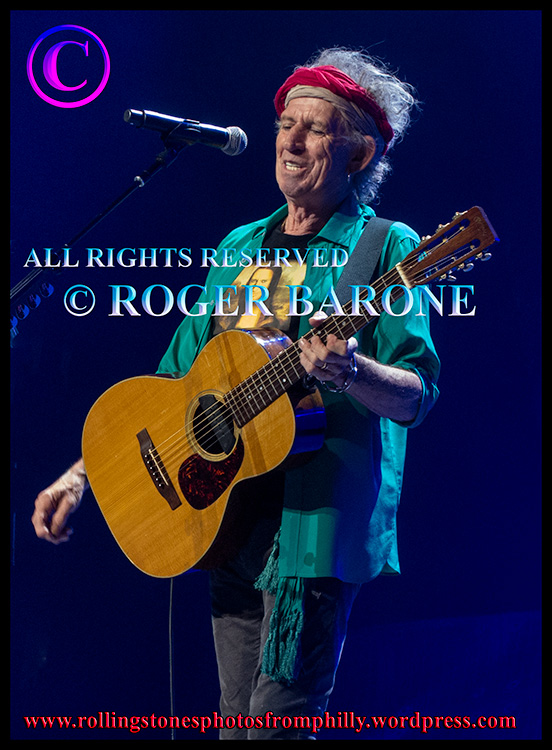 Keith Richards playing acoustic guitar at Wells Fargo Center, june 21, 2013. photo by roger barone
