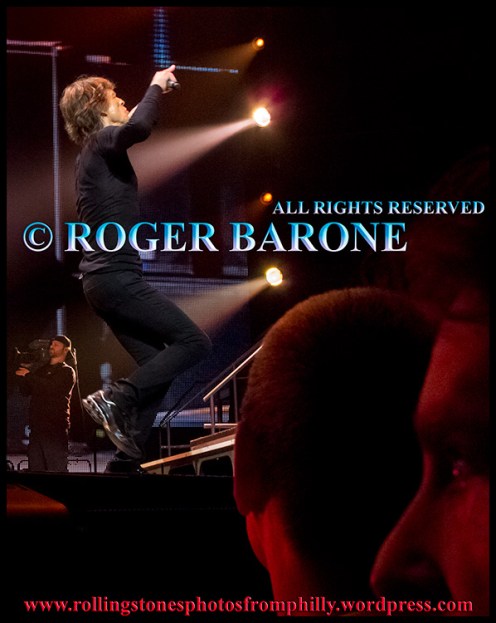 Mick Jagger performs "Brown Jagger" as fans look on. Wells Fargo Center, june 21, 2013. © Roger Barone
