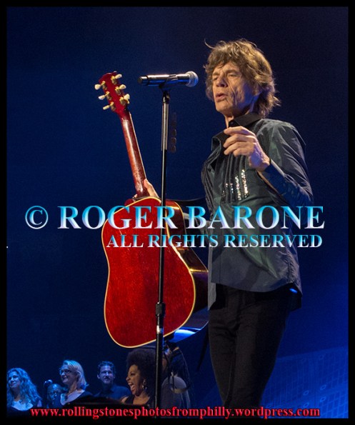 Mick Jagger playing "You Can't Always Get What You Want" with Gibson Hummingbird acoustic guitar. Wells Fargo Center 2013. photo by roger barone