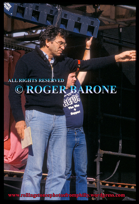 Legendary promoter Bill Graham directs stage setup at JFK Stadium for the Rolling Stones. september 24, 1981. photo by Roger Barone