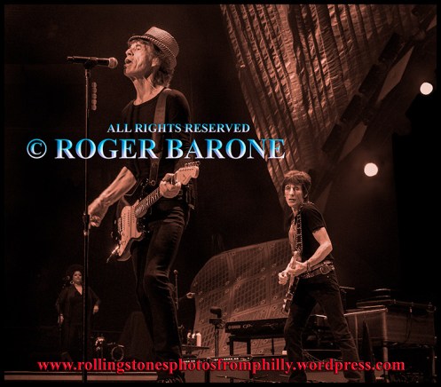 Mick Jagger Ronnie Wood playing "When The Whip Comes Down" Wells Fargo Center Philly, June 21, 2013. photo roger barone