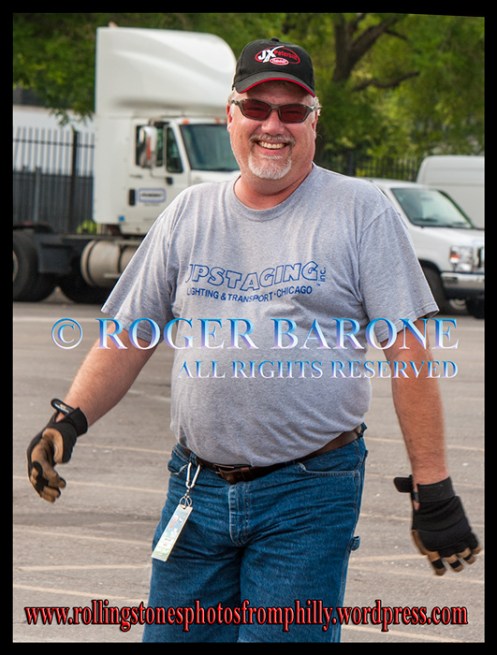 Rolling Stones' truck driver, Randy Bates, walks through Wells Fargo parking lot. june 18, 2013. photo by roger barone